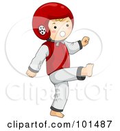 Happy Boy Wearing A Helmet And Doing Taekwondo