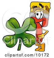 Paint Brush Mascot Cartoon Character With A Green Four Leaf Clover On St Paddys Or St Patricks Day