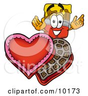 Paint Brush Mascot Cartoon Character With An Open Box Of Valentines Day Chocolate Candies