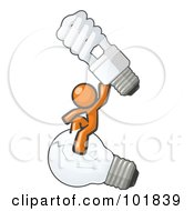 Orange Man Design Mascot Sitting On An Old Light Bulb And Holding Up A New Energy Efficient Bulb