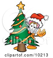 Pencil Mascot Cartoon Character Waving And Standing By A Decorated Christmas Tree