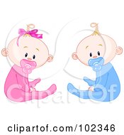 Boy And Girl Baby Twins With Pacifiers