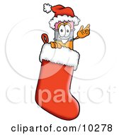 Pencil Mascot Cartoon Character Wearing A Santa Hat Inside A Red Christmas Stocking