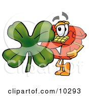 Red Telephone Mascot Cartoon Character With A Green Four Leaf Clover On St Paddys Or St Patricks Day