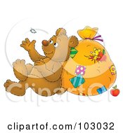 Bear Leaning Against A Sack And Watching A Floating Feather
