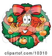 Red Telephone Mascot Cartoon Character In The Center Of A Christmas Wreath by Mascot Junction