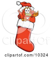 Red Telephone Mascot Cartoon Character Wearing A Santa Hat Inside A Red Christmas Stocking by Mascot Junction