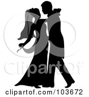 Silhouetted Newlywed Couple Dancing At Their Wedding