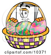 Paper Mascot Cartoon Character In An Easter Basket Full Of Decorated Easter Eggs