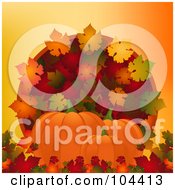 Three Pumpkins With Colorful Autumn Leaves Over Orange