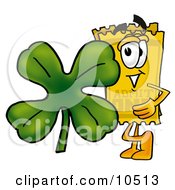 Yellow Admission Ticket Mascot Cartoon Character With A Green Four Leaf Clover On St Paddys Or St Patricks Day