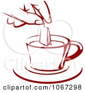 Poster, Art Print Of Hand Holding A Tea Bag Over A Cup