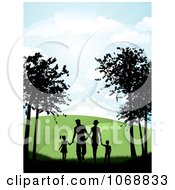Silhouetted Family Holding Hands And Walking On A Path