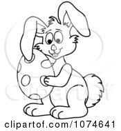 Clipart Outlined Easter Bunny Holding An Egg Royalty Free Vector Illustration