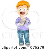 Happy Boy Touching And Holding A Rock