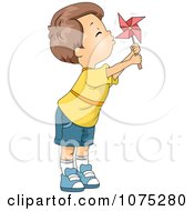 Cute Boy Blowing A Pinwheel