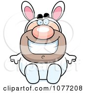 Clipart Sitting Man In An Easter Bunny Costume Royalty Free Vector Illustration