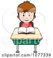 School Boy Reading At His Desk
