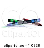 Green Blue And Red Crayons On A White Background