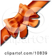 Gift Present Wrapped With An Orange Bow And Ribbon