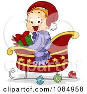 Christmas Toddler Sitting In A Sleigh With A Gift