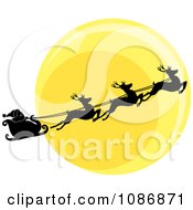 Silhouetted Santa Sleigh And Flying Reindeer Against The Christmas Eve Moon