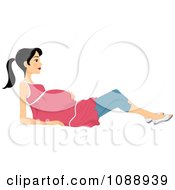 Pregnant Woman Reclining And Holding Her Belly
