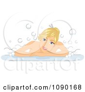 Blond Woman Smiling And Leaning Over The Rim Of A Bubble Bath