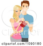 Young Couple Holding Pieces Of A Heart Together