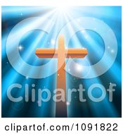 Clipart Christian Crucifix Against Blue Heavenly Rays And Sparkles Royalty Free Vector Illustration