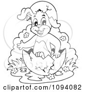 Clipart Outlined Easter Bunny In An Egg Shell Royalty Free Vector Illustration