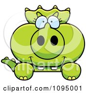 Clipart Green Baby Triceratops Looking Over A Surface Royalty Free Vector Illustration