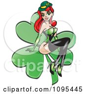Clipart Sexy St Patricks Day Irish Redhead Pinup Woman On A Shamrock Royalty Free Vector Illustration