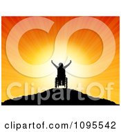 Silhouetted Person In A Wheelchair On A Hilltop Holding Their Arms Up Against The Sunset