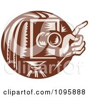 Poster, Art Print Of Retro Brown Box Camera And Photographers Hand Holding A Finger Up