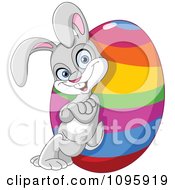 Clipart Happy Easter Bunny Leaning Against A Rainbow Egg Royalty Free Vector Illustration by yayayoyo