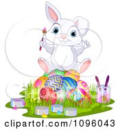 Clipart Cute Bunny Sitting On Top Of A Pile Of Painted Easter Eggs Royalty Free Vector Illustration