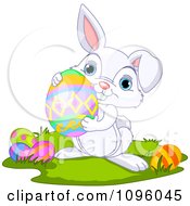 Clipart Cute Bunny Holding An Easter Egg Royalty Free Vector Illustration