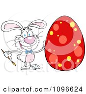 Clipart White Easter Bunny Painting A Red Dotted Egg Royalty Free Vector Illustration