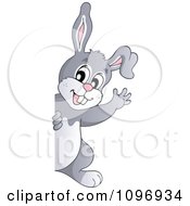 Clipart Happy Easter Rabbit Waving Around A Sign Royalty Free Vector Illustration