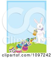 Poster, Art Print Of Cute White Easter Bunny Carrying A Basket And Leaving A Trail Of Eggs With Copyspace On Blue