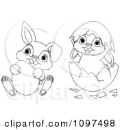 Clipart Cute Outlined Easter Bunnies Playing With An Egg And Shell Royalty Free Vector Illustration