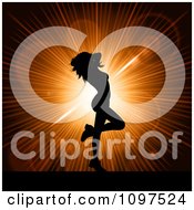 Poster, Art Print Of Sexy Silhouetted Woman Dancing Over An Orange Burst