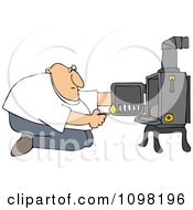 Man Kneeling In Front Of His Heat Stove To Light A Fire