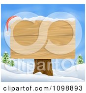 Poster, Art Print Of Santa Hat On The Corner Of A Wooden Christmas Sign In A Winter Landscape