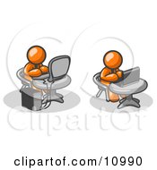 Two Orange Men Employees Working On Computers In An Office One Using A Desktop The Other Using A Laptop