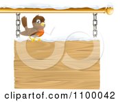 Poster, Art Print Of Happy Robin Perched On A Winter Sign With Snow