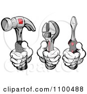 Gloved Hands Holding A Hammer Wrench And Screwdriver