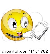 Clipart Yellow Smiley Holding A Tablet Royalty Free Vector Illustration