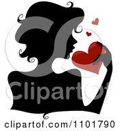 Poster, Art Print Of Silhouetted Woman Holding A Red Heart